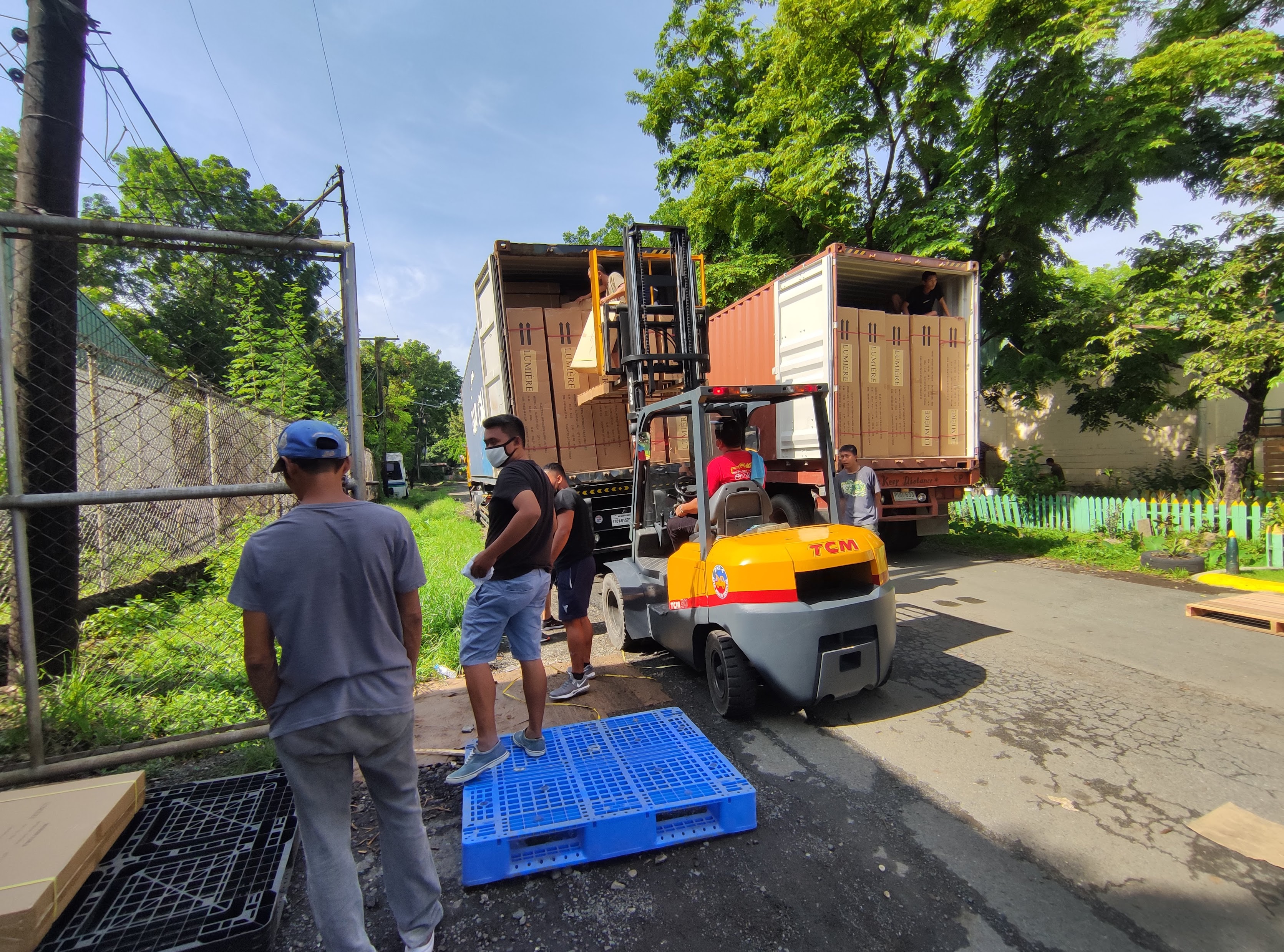 Forklift unloading shipping containers